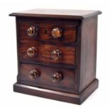 Victorian mahogany apprentice chest of three drawers, each containing sea shell specimens, 13.25"