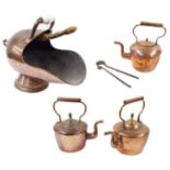 Three Victorian copper kettles, the tallest 13.5" high; together with a copper coal scuttle with