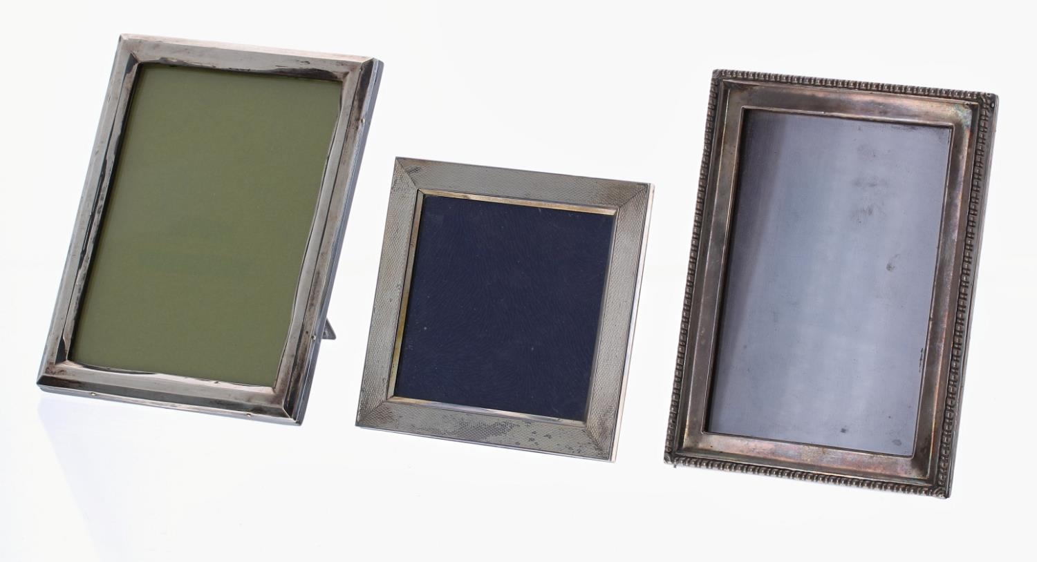 Two silver rectangular strut photograph frames, both Birmingham early 20th century, largest 6.5" x