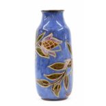 Royal Doulton stoneware glazed vase, the tapering body decorated with tulips on a blue ground,