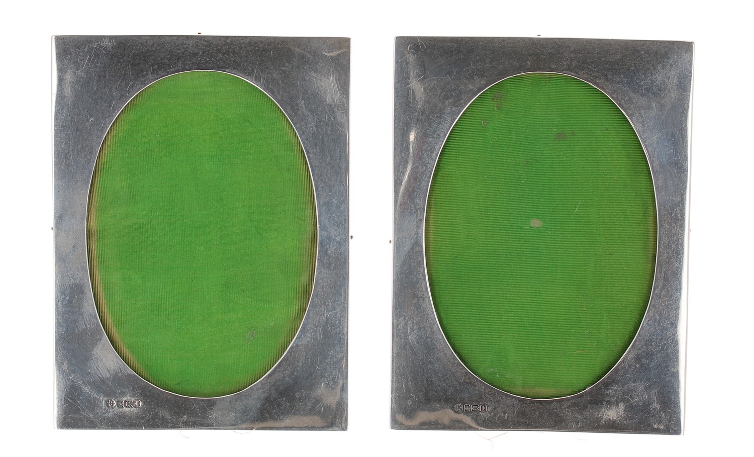 Pair of William Hutton & Sons Ltd. silver photograph frames, with oval apertures, 4.75" x 6.5"