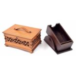 Set of antique bone and ebonised dominoes, within an Edwardian pierced fret carved casket, 10" wide,