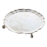 Sanders & Mackenzie silver card tray, with moulded shaped rim, raised on four leaf scroll feet, 8.