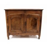 19th century provincial French fruitwood low cabinet, the rectangular top over a pair of shaped