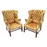 Good pair of tan leather studded button-back wing armchairs in the Georgian style, each with