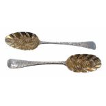 Two similar Georgian silver serving spoons, with gilt embossed bowls and foliate engraved handles,