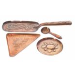Three pieces of Newlyn copper including a fish design triangle 6" tray, circular dish and a a