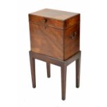 Small George III mahogany cellarette, the hinged top opening to reveal six compartments and the