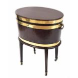 George III mahogany oval brass bound wine cooler on stand, the hinged top with side brass carry