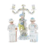 Late 19th century German porcelain figural two branch candelabra, modelled with a shepherd boy