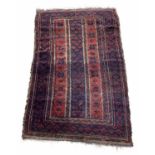 Red on navy ground Belouch rug, 61" x 41"