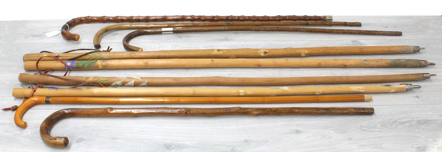 Collection of vintage walking sticks within a circular glazed floral stick stand, the stand 18" high