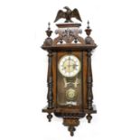 Vienna two-train wall clock, with eagle finial pediment over pillared case, 34" high (pendulum and