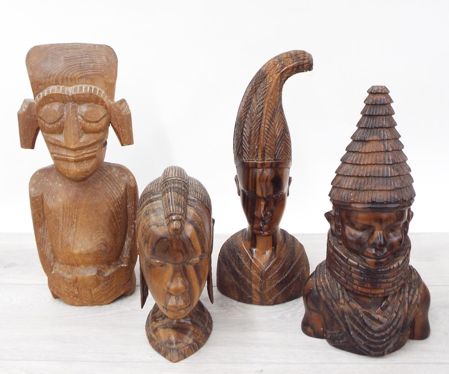 Four African hardwood figural bust carvings, the tallest 13" high (4)