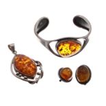 Silver and amber set bangle, pennant and a pair of earrings, the pendant drop 64mm approx (4)