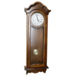 Large 31 day two-train Vienna type wall clock, the dial signed Polaris, 59" high (pendulum and one