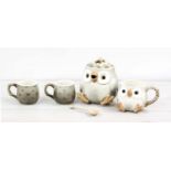 Fitz & Floyd Inc. novelty pottery teapot modelled as an owl; together with a mug, spoon and pair