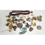 Collection of assorted costume jewellery, primarily brooches and rings, hardstone bead necklace,