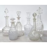 Six assorted 19th century and later glass decanters and stoppers, the tallest decanter 13" high