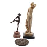 Baranite pure bronze figurine of an Art Deco dancer, mounted upon a pink onyx socle, 7.25" high;