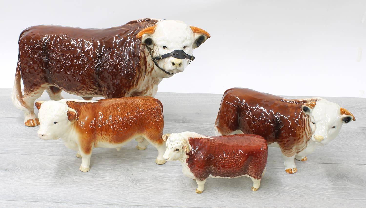 Beswick glazed model of a Hereford bull 'CH of Champions', 7.5" long (feet restored); together