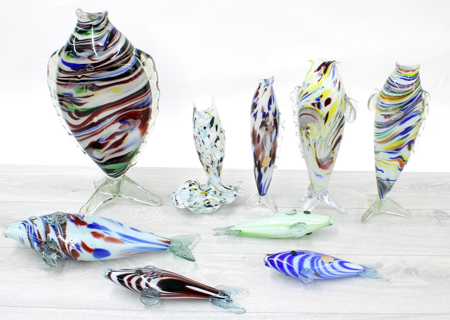 Collection of 'End of Day' mottled glass fish design vases and ornaments, the tallest vase 16"
