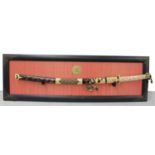 Decorative reproduction of the Imperial Sword of Samurai, mounted upon an ebonised lacquered plaque,