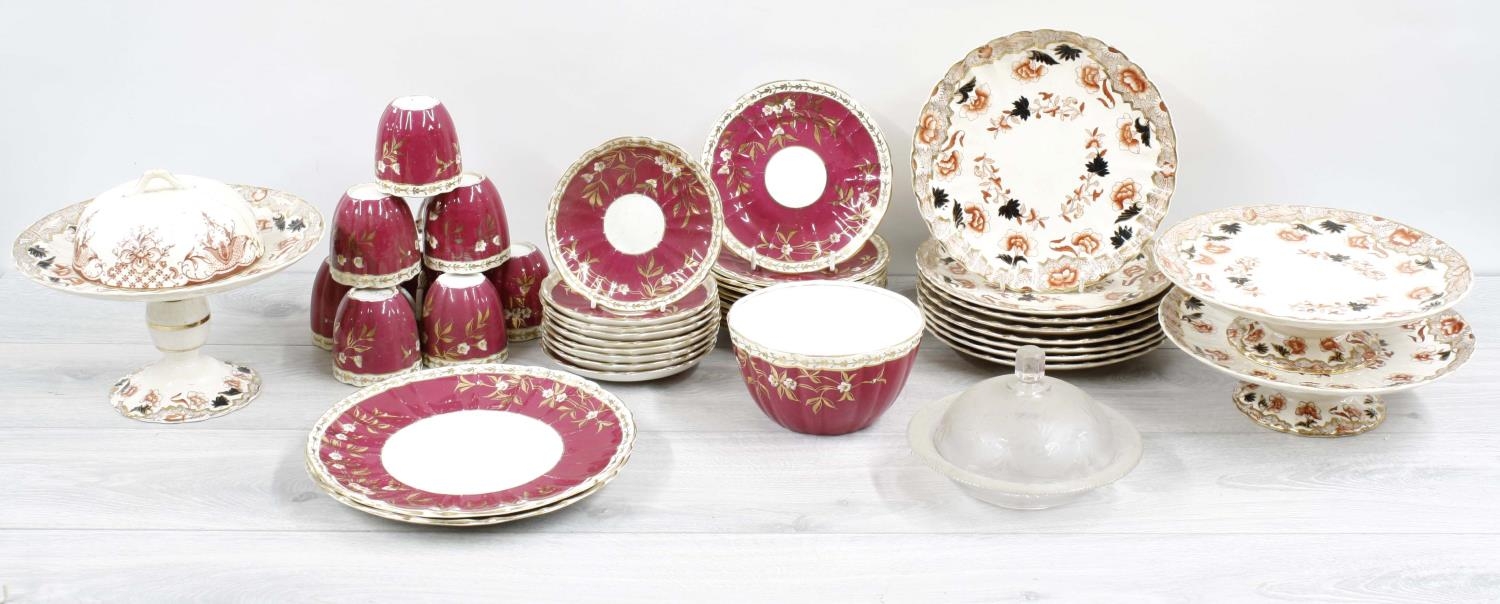 19th century porcelain part tea service, with gilt floral sprays and highlights on a purple