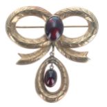 9ct engraved bow style brooch set with two cabochon garnets, 18.4gm, 52mm wide (140104-1-A)
