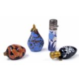Four scent bottles to include a teardrop white enamelled black glass scent bottle, with brass hinged