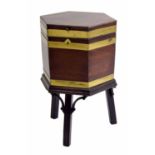George III mahogany wine cooler on stand, of hexagonal form with brass banding, the hinged cover