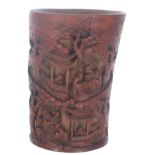 Chinese carved bamboo brush pot, decorated in relief with figural pagoda among woodlands scenes,