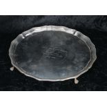 Boodle & Dunthorne circular silver card tray, with moulded rim raised upon four claw and ball