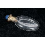 19th century gilt metal mount clear glass oval scent bottle, the gilt hinged cover elaborately