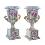 Pair of Vienna porcelain Campagna urn vases, decorated with floral panels within gilt highlights,