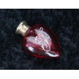 Victorian miniature silver mount cranberry glass scent bottle of heart shape form, with white