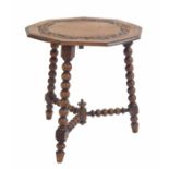 Oak nonagon bobbin turned side table, the moulded top with relief carved foliate scrolling border
