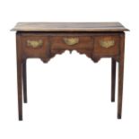 Georgian oak lowboy, the rectangular top over three short drawers to the shaped apron and upon