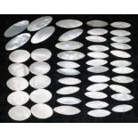 Collection of Chinese mother of pearl gaming counters, oval/elliptical, of varied pattern, some with