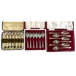 Selection of cased silver tea and coffee spoons; six by Eugene Leclere with coffee bean finials, six