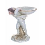 Royal Worcester James Hadley design figural bonbon dish, modelled as a boy with basket upon his