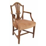 Sheraton period mahogany armchair, the shield pierced back with wheatsheaf moulding over an oval