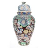 Large decorative Chinese porcelain vase with cover, decorated with dragons among clouds, with floral