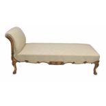 Regency gilt stuff-over upholstered chaise longue, the seat and back in cream damask upholstery on