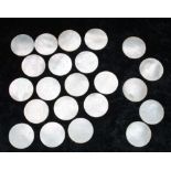 Collection of Chinese mother of pearl gaming counters, circular, seventeen with central griffin