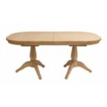 Neptune oak twin-pedestal Henley extending dining table with two extra leaves, 107" long fully