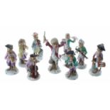 Collection of nine German 19th century porcelain 'monkey band' figures in the manner of Meissen,