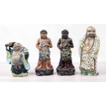 Collection of four assorted Japanese pottery figures including one of Buddha, tallest Kutani ware