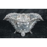 George V pierced silver basket, with repousse scroll rim and decoration around vacant cartouche,