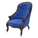 Victorian mahogany blue button-back spoon back armchair, with cabriole legs terminating with white